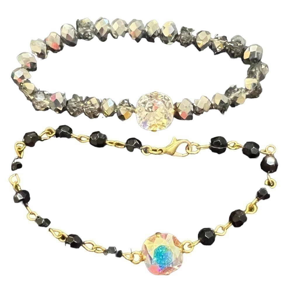 𝅺2 Like New Bracelets each with 1 stone